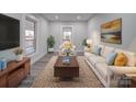 Bright living room featuring hardwood floors and comfy seating at 221 Palmer St, Albemarle, NC 28001