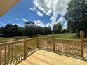 Brand new wooden deck offers a scenic view of the surrounding landscape at 184 Maplewood Ln, Taylorsville, NC 28681
