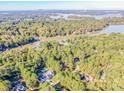 Aerial view showcasing home's waterfront lot and neighborhood at 335 Blume Rd, Mooresville, NC 28117