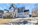 Two-story house with blue siding and two-car garage at 19935 Wooden Tee Dr, Davidson, NC 28036