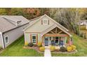 Aerial view of house showing landscaping and neighborhood at 226 Hickory St, Locust, NC 28097