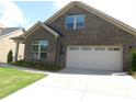 Charming brick home with a two-car garage and well-manicured lawn at 409 Newstyle Way # 3, Cramerton, NC 28056