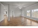 Bright living room features wood floors, neutral walls, ceiling fan, and plenty of natural light at 4759 Mel Nunnery Rd, Fort Lawn, SC 29714