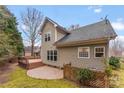 Backyard with a wood deck, a brick paver patio, and a wooden fence at 7708 Spanish Oaks Dr, Waxhaw, NC 28173