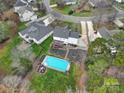 Aerial view showing house, pool, and backyard at 7721 Sedgebrook E Dr, Stanley, NC 28164