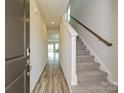 Welcoming entryway with hardwood floors and a staircase, inviting guests into the home's elegant interior at 827 Blue Canyon Dr, York, SC 29745