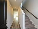 Inviting foyer with wood-look floors, a staircase with carpet, and natural light at 827 Blue Canyon Dr, York, SC 29745