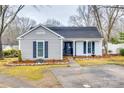 Charming ranch home with gray siding, white trim, and landscaped yard at 2722 Hillmont Dr, Charlotte, NC 28226