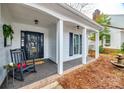 Inviting front porch with rocking chair and decorative accents at 2722 Hillmont Dr, Charlotte, NC 28226