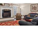 Living room fireplace with a dark granite hearth at 4006 Sincerity Rd, Monroe, NC 28110