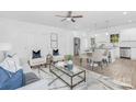 Open concept kitchen with white cabinets and granite countertops at 5633 Torrence St, Charlotte, NC 28269