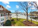 View of lakefront property with boats and a marina at 703 Southwest Dr, Davidson, NC 28036