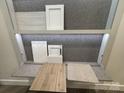 Image showcases various flooring, tile, and cabinetry samples for the home at 8026 Cedarsmith Ct, Charlotte, NC 28217