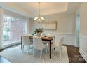 Formal dining room with hardwood floors and chandelier at 810 Carisbrooke Ln, Waxhaw, NC 28173