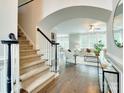 Bright entryway with hardwood floors and view of living room at 810 Carisbrooke Ln, Waxhaw, NC 28173