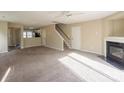 Spacious living room with fireplace and carpet flooring at 13406 Tartarian Ct, Charlotte, NC 28215