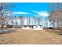 Ranch home with updated exterior, situated on a spacious lot at 2108 Sherwood Forest Ln, Monroe, NC 28110