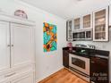 Clean kitchen, featuring stainless steel appliances and ample cabinet space at 509 N Graham St # 1G, Charlotte, NC 28202