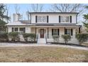 Stunning two-story home with white exterior and black accents at 5910 Grosner Pl, Charlotte, NC 28211