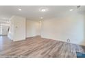 Light-filled living room with hardwood floors and fireplace at 8230 Verona Rd # 80, Charlotte, NC 28213