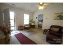 Living room with leather furniture, access to bedroom and front entrance at 2038 Mallard Creek Dr, Rock Hill, SC 29732