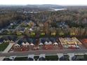 Scenic aerial view of home construction with lake views and autumn trees, highlighting the community's natural beauty at 3341 48Th Ne Ave # 15A, Hickory, NC 28601
