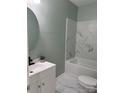 Updated bathroom with marble shower and vanity at 815 Jefferson St, Shelby, NC 28150