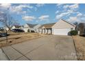 Two-car garage house with a driveway and landscaping at 1630 Hardy Dr, Rock Hill, SC 29732