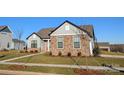 Charming one-story house with gray siding, stone accents, and a red door at 1846 Yardley St, Rock Hill, SC 29732