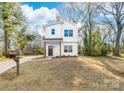 Charming two-story home with a modern mailbox, bright curb appeal, and landscaping at 211 Chestnut St, Shelby, NC 28150