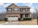 Two-story brick home with attached garage and landscaped lawn at 2548 Flintshire Ln, Gastonia, NC 28056