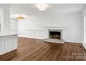 Bright living room with hardwood floors, fireplace, and large windows at 3453 Selwyn Ave, Charlotte, NC 28209