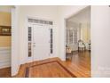 Bright entryway with hardwood floors and view into adjacent sitting area at 355 Sardis Rd N Alt Rd, Charlotte, NC 28270