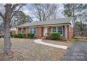 House exterior showcasing landscaping and walkway at 4201 Westridge Dr, Charlotte, NC 28208