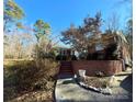 Brick home with a walkway, landscaping, and attached garage at 511 W Stevens Dr, Kershaw, SC 29067