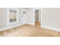 Bright living room with hardwood floors and lots of natural light at 526 S Green St, Statesville, NC 28677