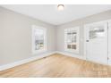 Light-filled living room featuring hardwood floors at 526 S Green St, Statesville, NC 28677