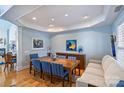 Bright dining room with hardwood floors and large windows at 8120 Oratorio Pl, Charlotte, NC 28270