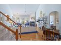 Spacious living room with hardwood floors, fireplace, and vaulted ceiling at 8120 Oratorio Pl, Charlotte, NC 28270