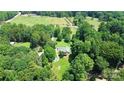 Overhead angle showcases the home site in a wooded area at 1769 Old Nc 27 Hwy, Mount Holly, NC 28120
