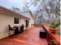 Spacious deck with wooden railings and seating area at 1769 Old Nc 27 Hwy, Mount Holly, NC 28120