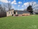 Charming brick home featuring a well-manicured lawn and thoughtfully designed landscaping, enhancing its curb appeal at 1769 Old Nc 27 Hwy, Mount Holly, NC 28120