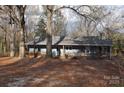 Blue house with a large front porch and yard at 733 Azalea Dr, Chester, SC 29706