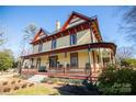 Two-story Victorian home with wrap-around porch and charming details at 106 N Battleground Ave, Kings Mountain, NC 28086