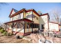 Side view of the house showcasing screened porch and patio area at 106 N Battleground Ave, Kings Mountain, NC 28086