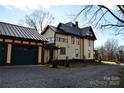 Detached three-car garage with dark green doors at 106 N Battleground Ave, Kings Mountain, NC 28086