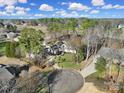 Drone shot of an estate featuring a well manicured lawn and circular driveway at 115 Amelia Ln, Mooresville, NC 28117