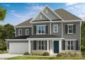Charming two-story home with gray siding, black shutters, and a welcoming front porch at 13312 Chopin Ridge Rd, Huntersville, NC 28078
