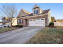 Two-story brick home with a two-car garage at 145 Chertsey Dr, Mooresville, NC 28115