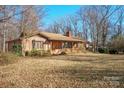 Brick ranch house with covered porch and expansive yard at 2452 Nc 182 Hwy, Lincolnton, NC 28092